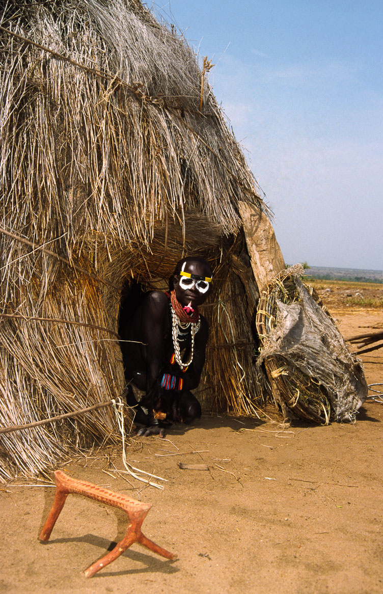 ET05186-A-Karo-emerging-from-his-hut.jpg