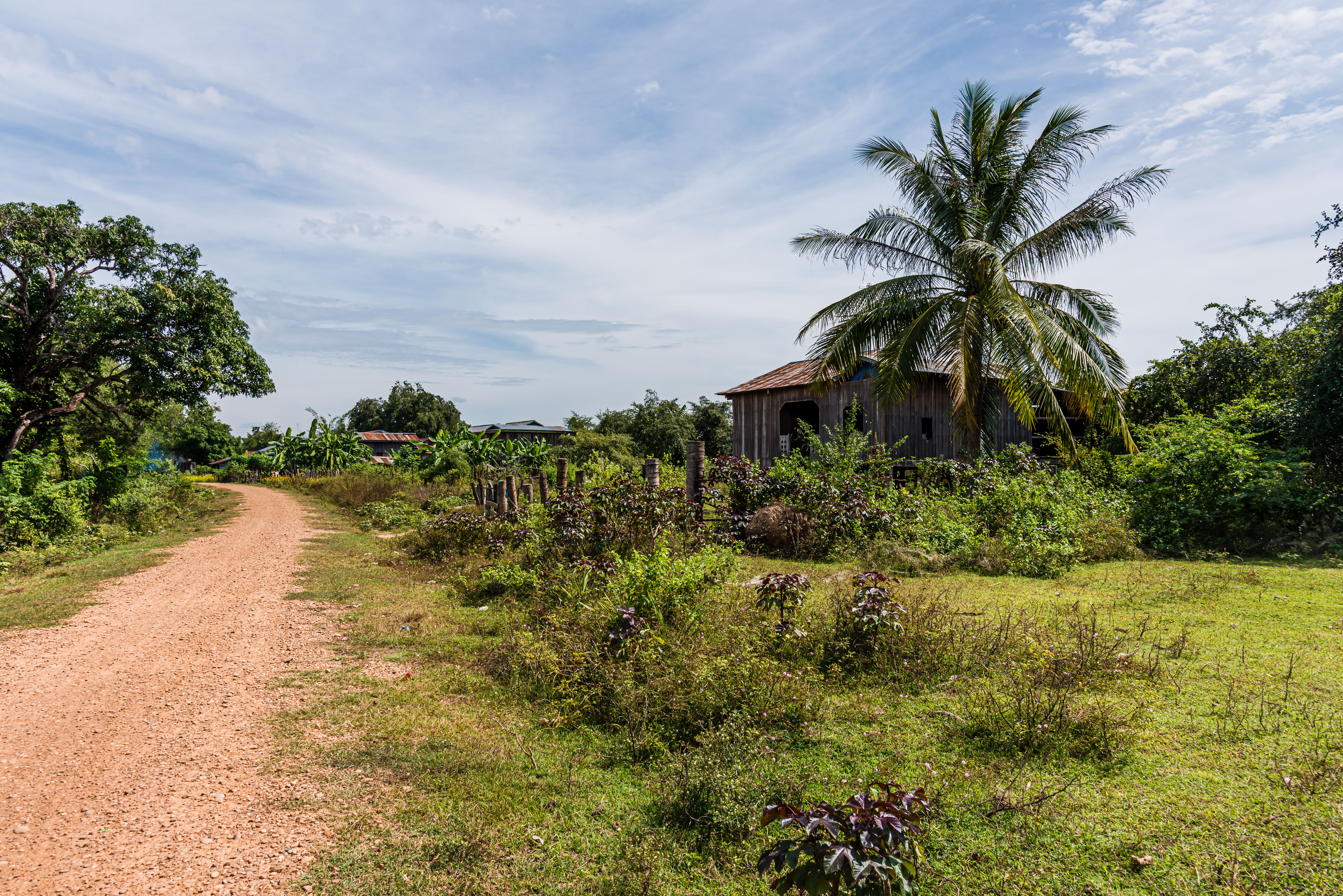 CA170062-Dirt-road-passing-small-farms.jpg