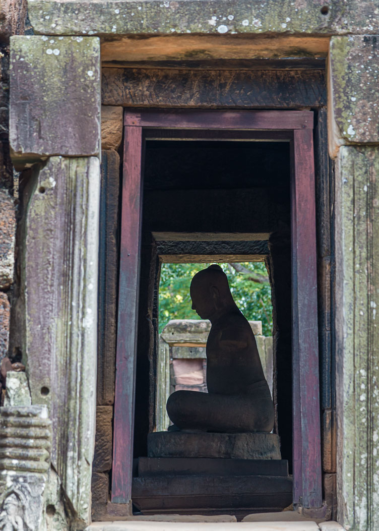 TL162389-Phimai---Meditating-figure-inside-the-tower.jpg