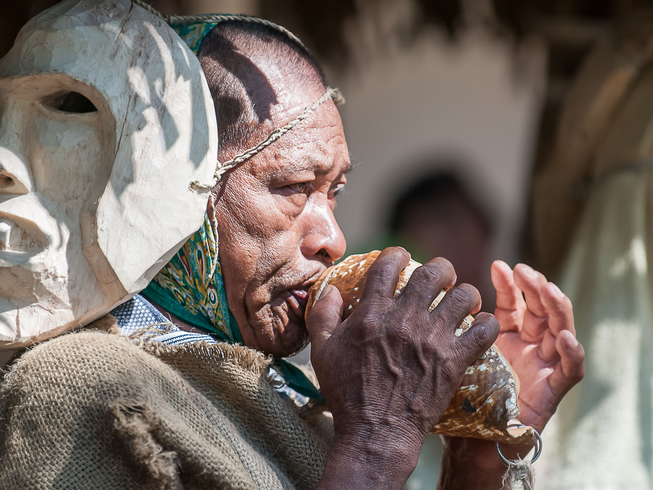 CR120970-Edit-Elder-blowng-a-conch-shell-Rey-Curr---Fiesta-de-los-Diablitos.jpg