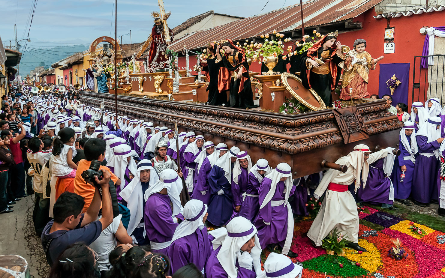 AN120259-Edit-Procession-walking-over-a-carpet.jpg